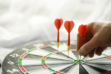Fototapeta premium Darts. The dart for playing in the game board is stuck. Hit the sector in darts. The concept of a successful strategy.