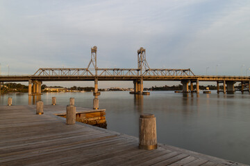 Fototapeta na wymiar Wooden pier and Ryde Bridge view, Sydney, Australia.