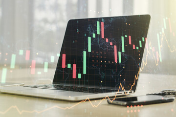 Multi exposure of abstract financial graph with world map on modern computer background, financial and trading concept