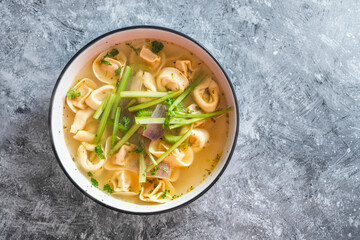 plant-based food, vegan ravioli pasta with vegetable broth and celeri