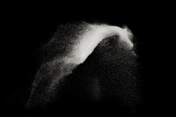 Fine sea salt or fine sugar splash explosion on black background ,stop motion food object design