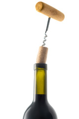 Wine and corkscrew on white background