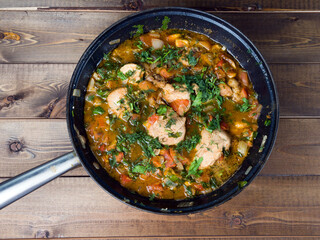 Chokhokhbili. Caucasian dish of chicken stew with bones with various spices. Home traditional cuisine