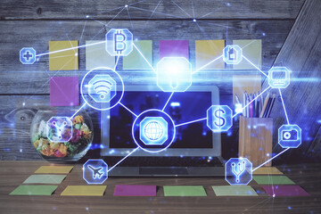 Computer on desktop with social network hologram. Double exposure. Concept of international people connections.