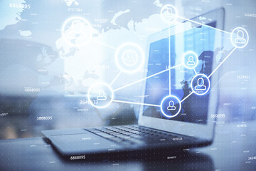 Computer on desktop with social network hologram. Double exposure. Concept of international people...