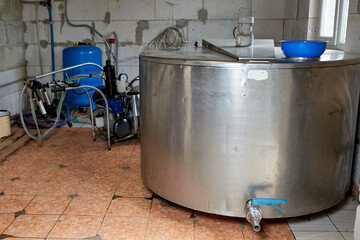 Fototapeta premium Equipment for milk production, dairy farms and animal husbandry.