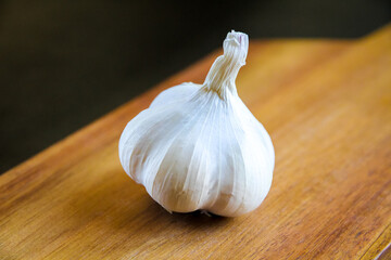 Organic fresh clove garlic on a cutting board