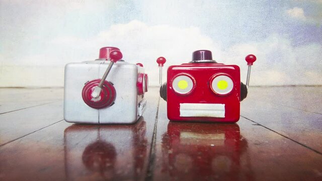 two robot head talking  on old wooden floor and sky background 