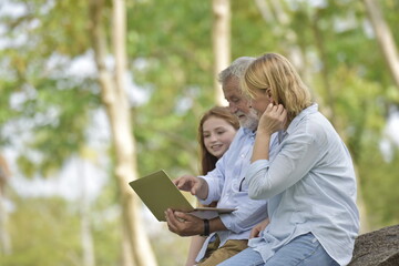 happy family of father, mother and daughter in park . Family and Insurance concept.