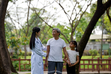 Female doctor and her elderly patient outdoor. Health and insurance concept.