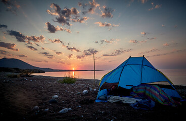 tent at dawn by the sea