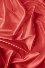 Beautiful elegant wavy hot red satin silk luxury cloth fabric texture, abstract background design. Wallpaper, banner or card with copy space.