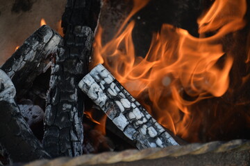 red fire rises from the combustion of wood in the barbecue, from the fire is a huge heat for cooking