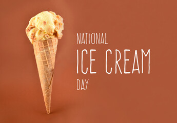 National Ice Cream Day stock images. Vanilla scoop ice cream stock images. Ice cream cone isolated on a brown background