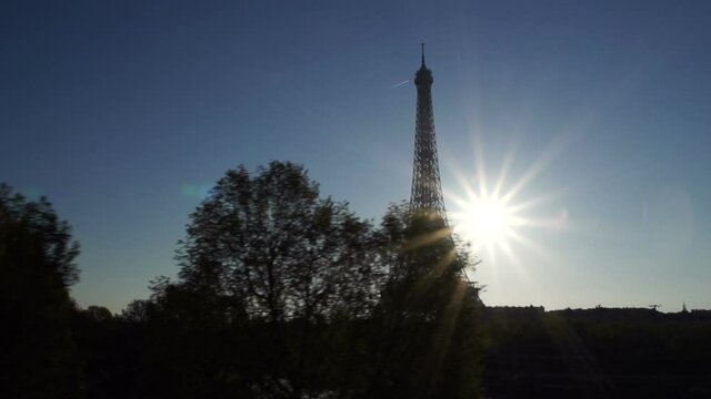 The Eiffel Tower in Paris at Dawn or sunrise. Filmed from metro with motion. Stock Video Clip Footage