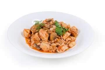Beans with mushrooms and chicken, stewed in tomato sauce, closeup
