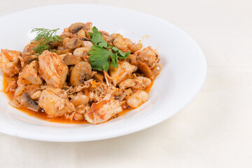 Stew beans with mushrooms, chicken in tomato sauce, close-up