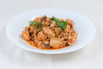 Stew beans with mushrooms, chicken in tomato sauce on dish