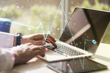 Double exposure of creative abstract heart rate hologram and hands typing on laptop on background....
