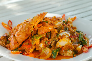 Stir Fried Crab with Curry Powder Thai food on white plate