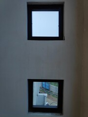 Many small blue glass windows in modern house.