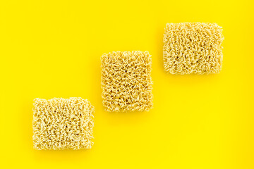 Instant noodle on Yellow background top view copy space mockup