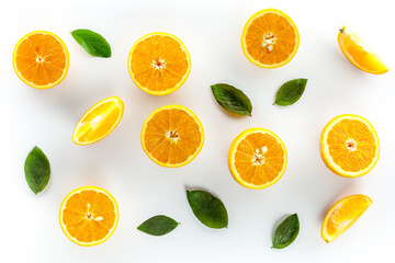 Orange slices on white background top view copy space
