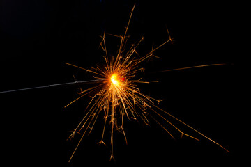 Obraz premium A lit sparkler showing bright sparks