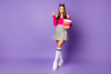Full length body size view of her she nice attractive charming amazed funky cheery girl eating corn pout lips isolated on bright vivid shine vibrant lilac violet purple color background