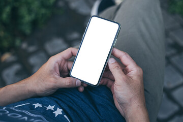 cell phone mockup image blank white screen.woman hand holding texting using mobile on desk at coffee shop.background empty space for advertise.work people contact marketing business,technology