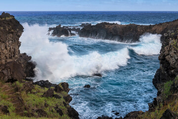 Fototapeta na wymiar Waves crashing on the rocks, Rapa Nui National Park, Easter Island, Chile