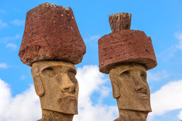 Ahu Nao-Nao Moais wearing a red hat, Anakena, Rapa Nui National Park, Easter Island, Chile, Unesco...