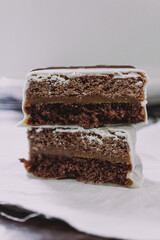 white and dark chocolate alfajores dessert on white background