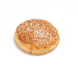 baked round bun with sesame seeds isolated on white background