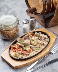 Variation of oven baked  stroganoff with vegetables, creamy gravy and potato