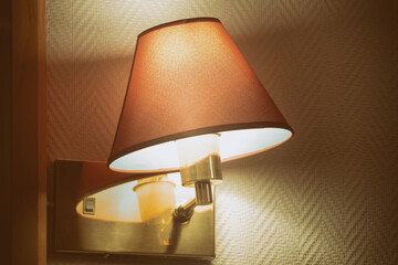 wall lamp with a lampshade in the interior