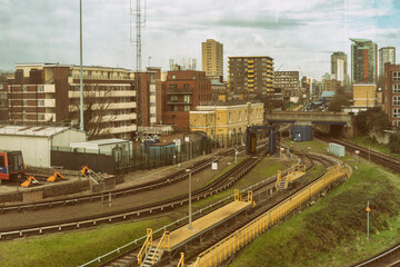 Obraz premium LONDON - MARCH 5, 2020: view of buildings and railways in urban infrastructure, metro