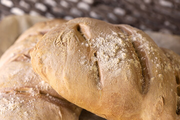 Homemade bread on rustic wooden background. Rustic bakery