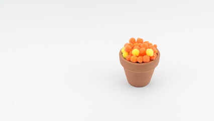 orange and yellow artificial potted flowers
