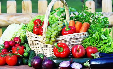 Variety of fresh organic vegetables in wicker basket