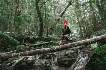 Beautiful asian woman enjoy view with snow during winter in New Zealand.