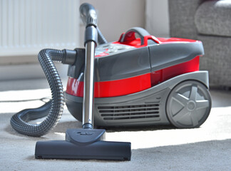 Canister vacuum cleaner for home use on the floor