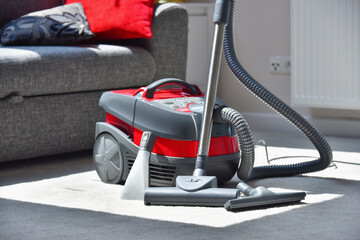 Canister vacuum cleaner for home use on the floor