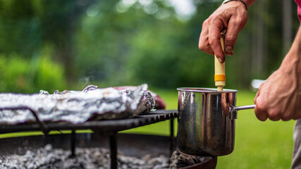 barbeque meat preparation in a summer day