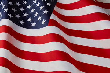 Close up of ruffled American flag. Satin texture curved flag of USA. Memorial Day or 4th of July....