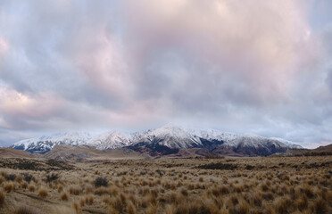 Panorama of Snow Mountain Range Landscape with Blue Sky background from New Zealand.