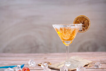 Cocktail on wooden background and space for text 