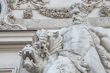 Statue of Hercules fighting Cerberus, a multi-headed dog beast that guards the gates of the Underworld from Classical Greek Mythology, Hofburg Palace, outdoor, Vienna, Austria, details, closeup - obrazy, fototapety, plakaty