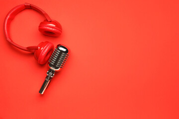 Headphones with microphone on color background