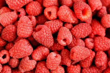 Ripe juicy fresh raspberries. Natural food background.
